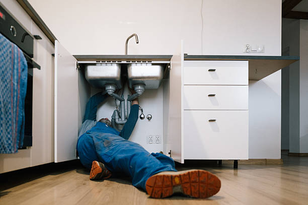 Professional Emergency Plumber technician working in Garrison, KY